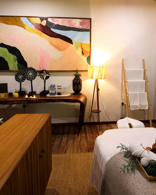 Spa treatment room with a fluted sideboard and a live-edge console